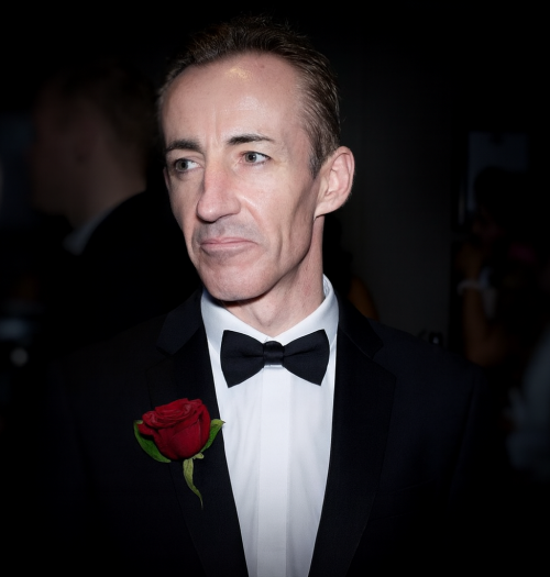 A.P. O’Neill, The Golf Magician and Founder of Quantum Leap Golf, wearing a black tuxedo